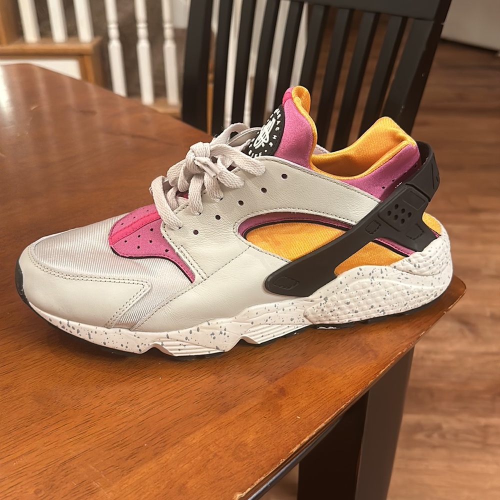 Cream, black, purple, and orange Nike Air Huarache